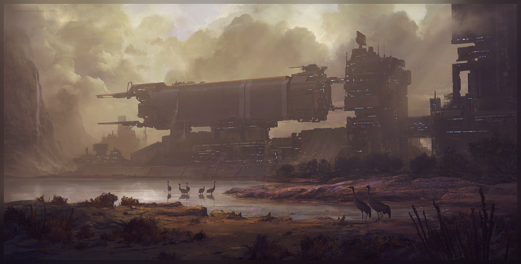 A large rectangular transport vessel docked to a tall industrial tower beside water where long-legged wading birds stand in a marshy landscape under soft cloudy daylight