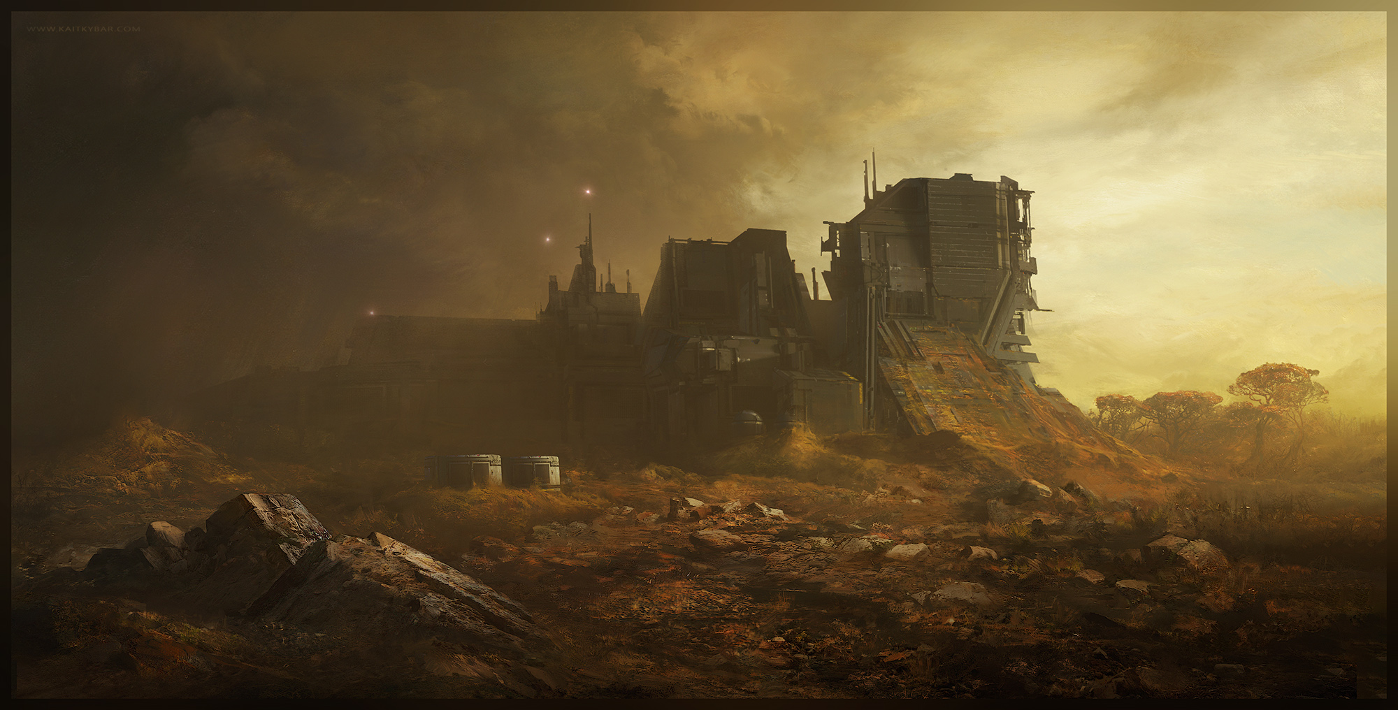 A blocky multi-tiered industrial complex on a rocky arid plain under a dusty atmosphere lit by warm golden light breaking through heavy clouds